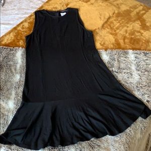Black sleeveless tulip mini dress